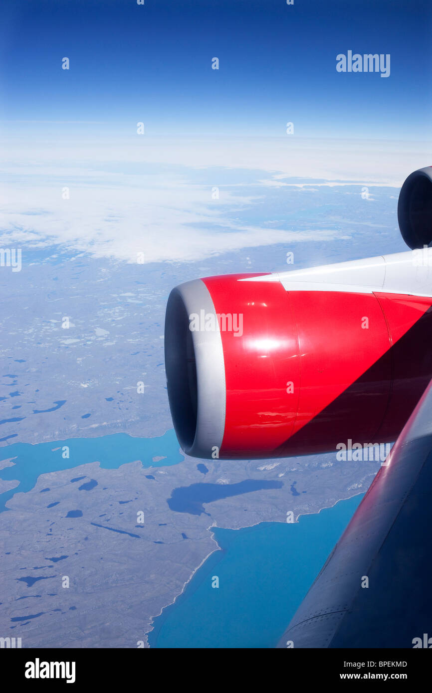Virgin Atlantic Airways 747-400s aircraft powered by  GE CF6-80C jet engines over Greenland Stock Photo