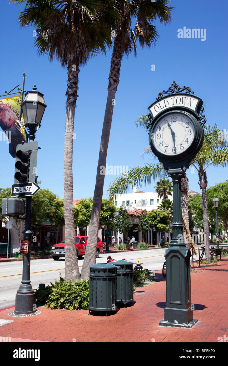 Wrought-iron street clock on the terracotta-tiled sidewalks of the old town area of Santa Barbara in California Stock Photo