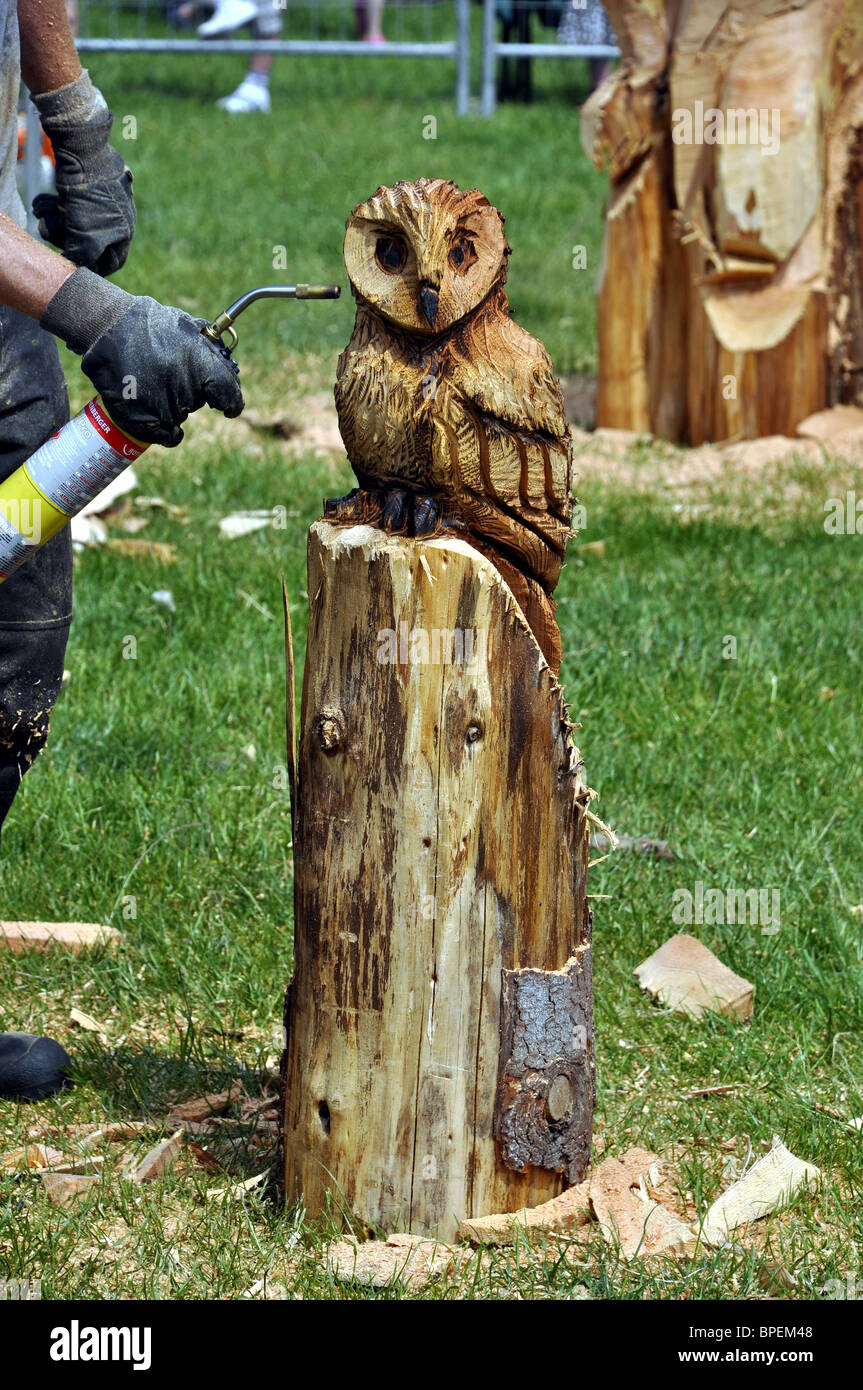 Competitor using a blowtorch in the Woodfest Wood Carving competition St Asaph North Wales UK Stock Photo