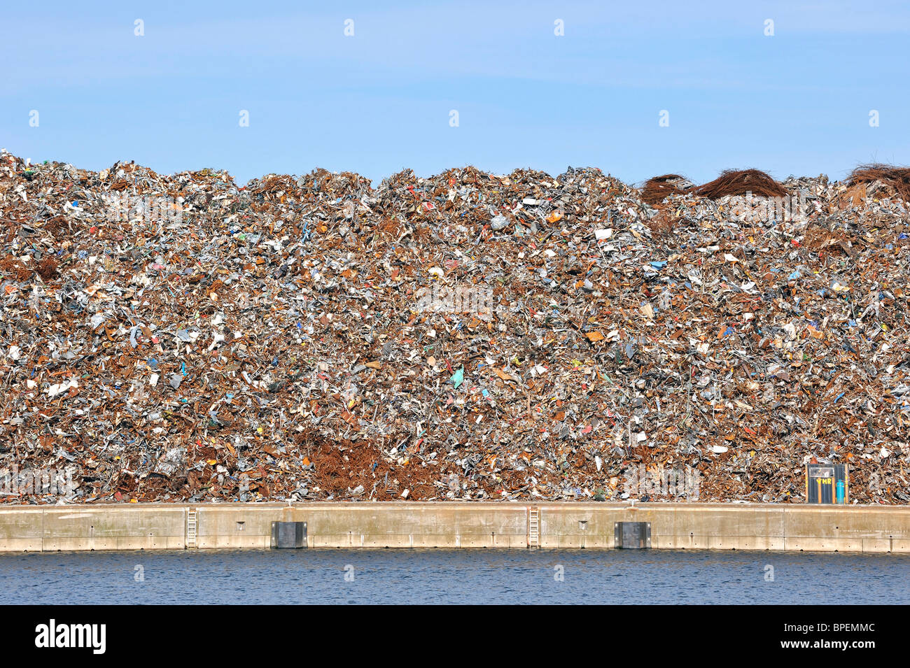 Scrap heap along the Ghent-Terneuzen Canal at Ghent seaport, Belgium Stock Photo