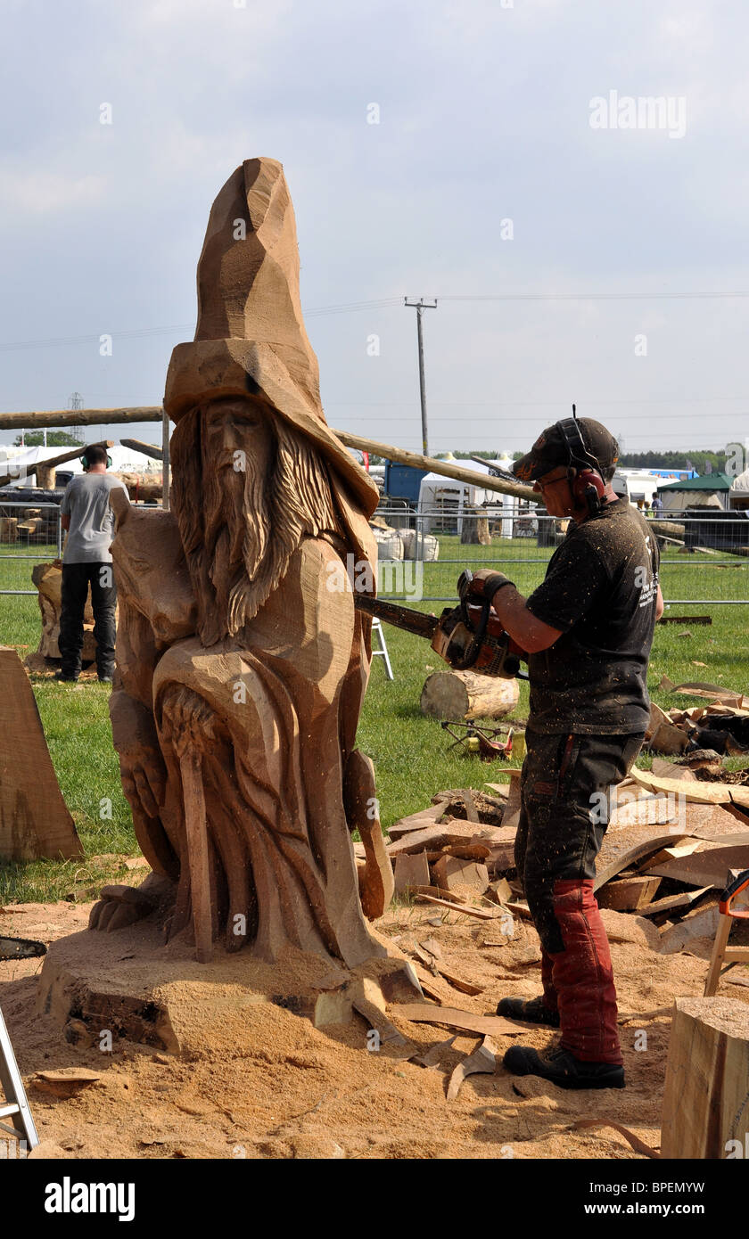 Competitor using a chainsaw  in the Woodfest Wood Carving competition St Asaph North Wales UK Stock Photo