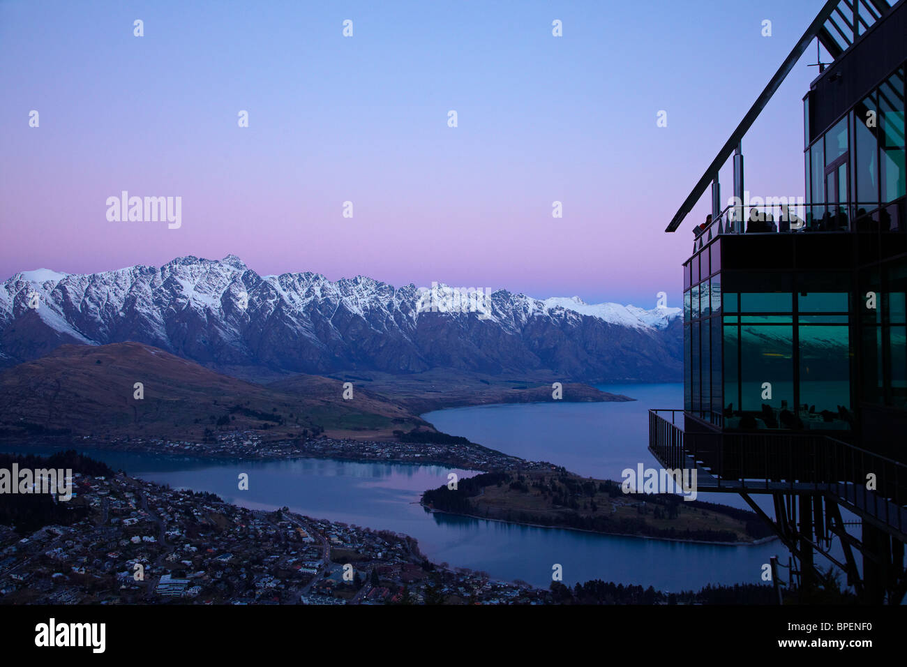 Dusk over Skyline Restaurant, The Remarkables and Lake Wakatipu, Queenstown, South Island, New Zealand Stock Photo