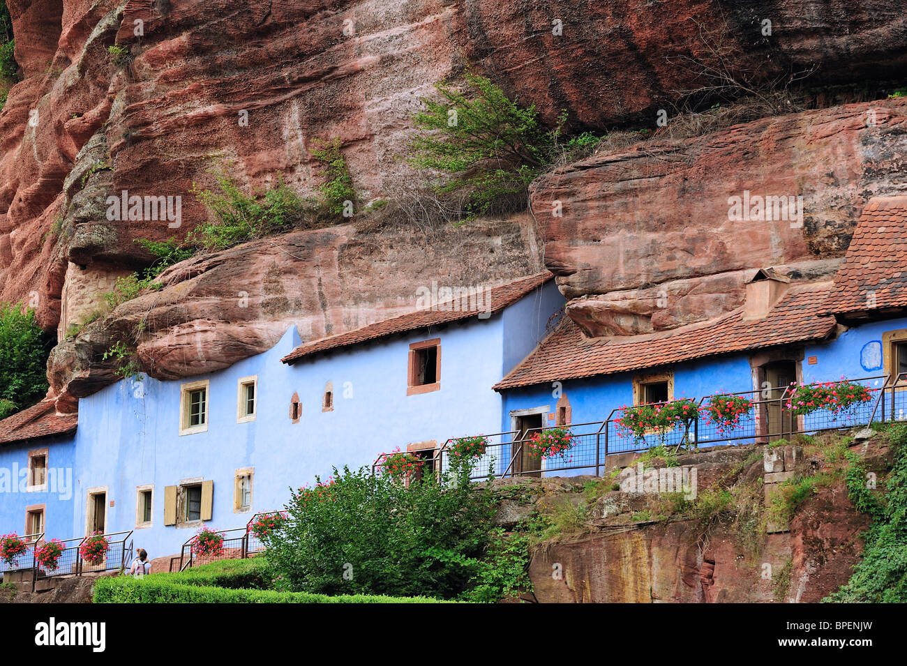 The blue troglodyte houses in rock face at Graufthal, Vosges, Alsace, France Stock Photo