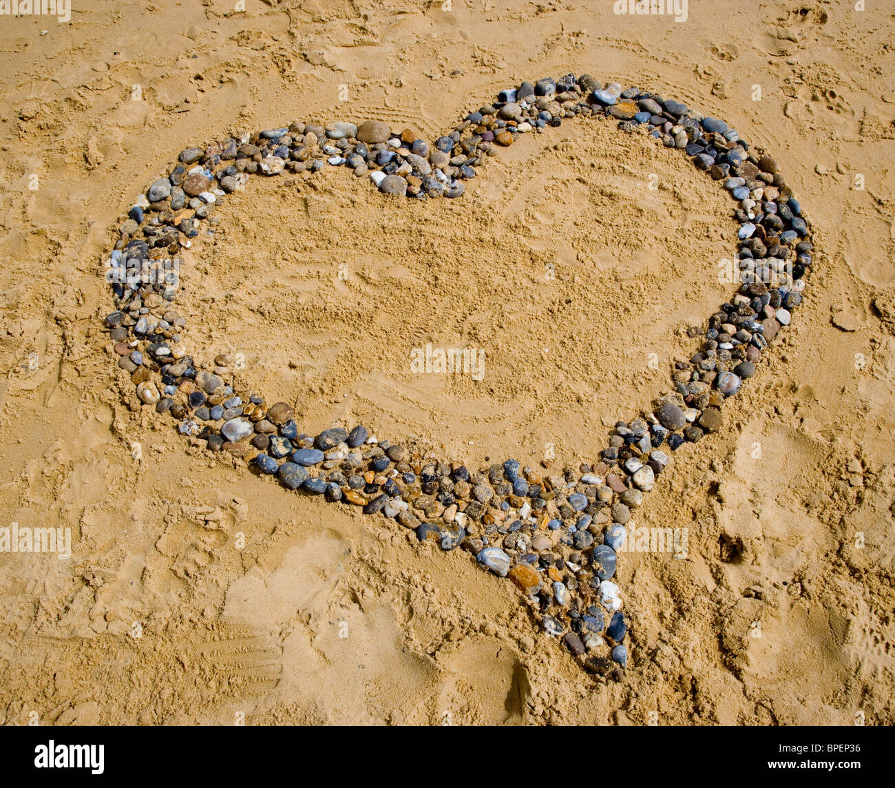 A heart made of pebbles on a beach Stock Photo Alamy