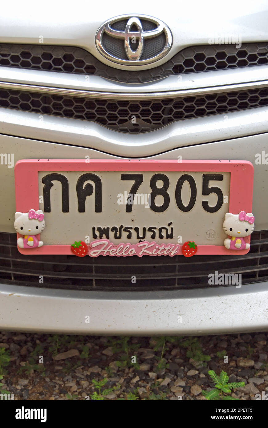 pink hello kitty number plate frame on a toyota car in phetchabun, thailand, south east asia Stock Photo
