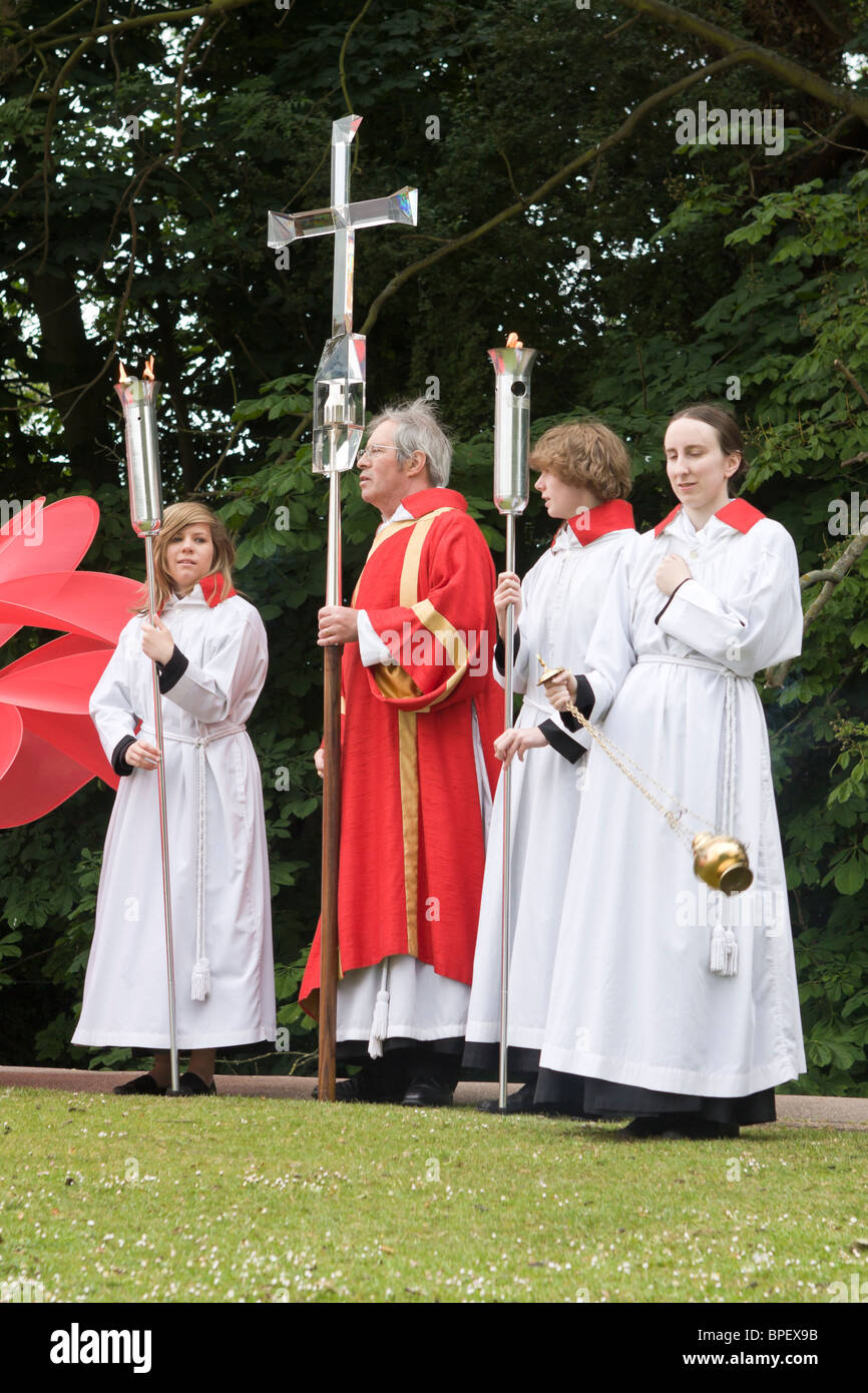 Church members holding crucifix and burning torches at Albantide parade, St Albans, UK 2010 Stock Photo
