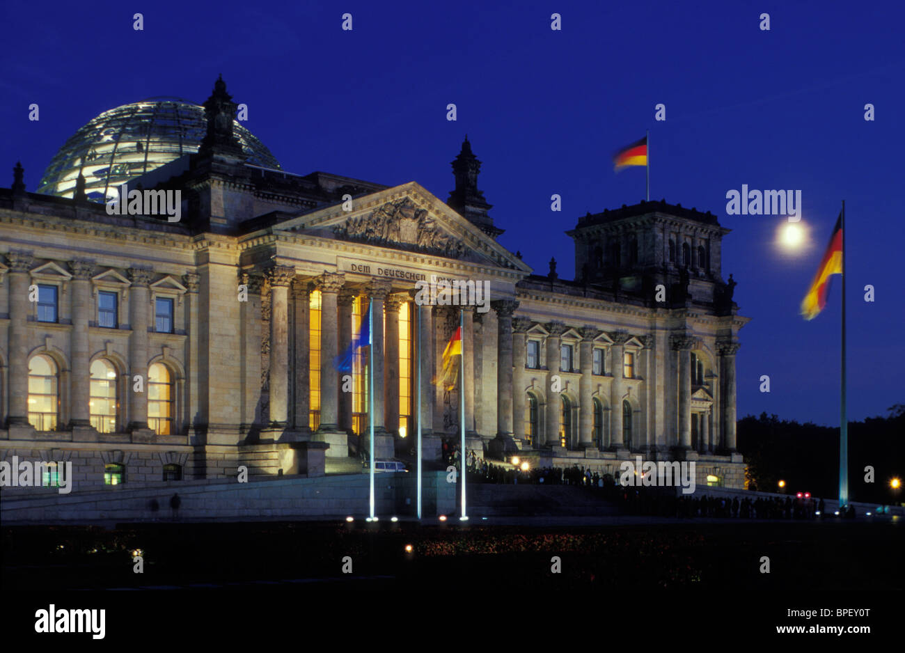 Reichstag Building With A German Flag And A Full Moon Berlin Reichstag Building With A German Flag And A Full Moon Berlin