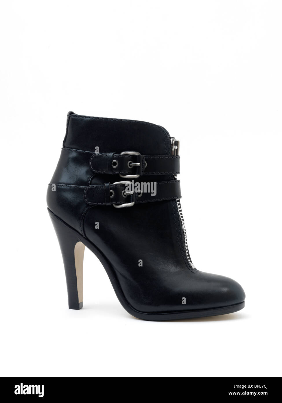Ladies Black Leather High Heeled Stiletto Ankle Boot with Silver Buckles and Zip Stock Photo
