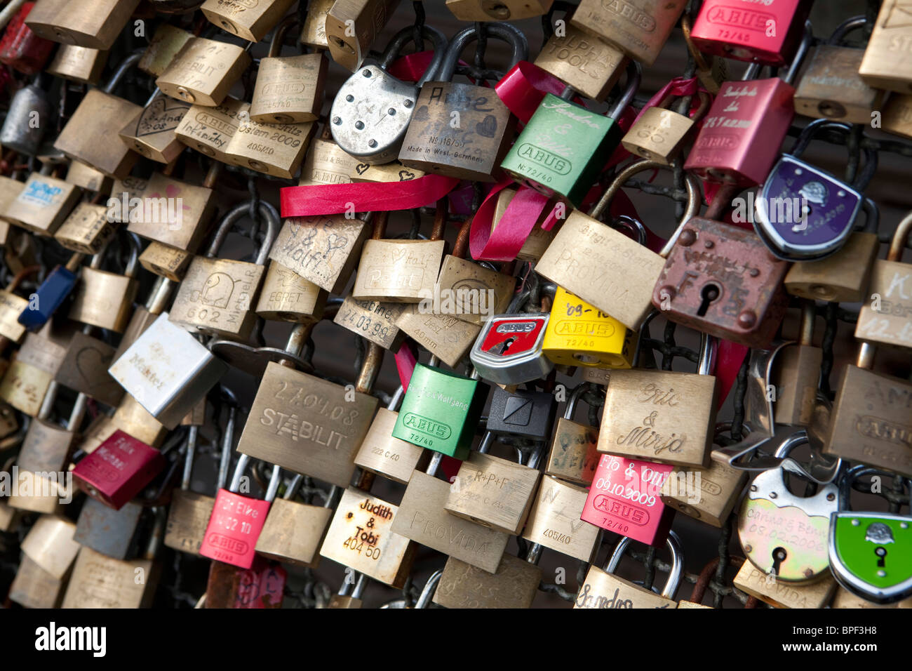 thousands of love - padlocks are hanging at the Hohenzollern Bridge in Cologne Stock Photo
