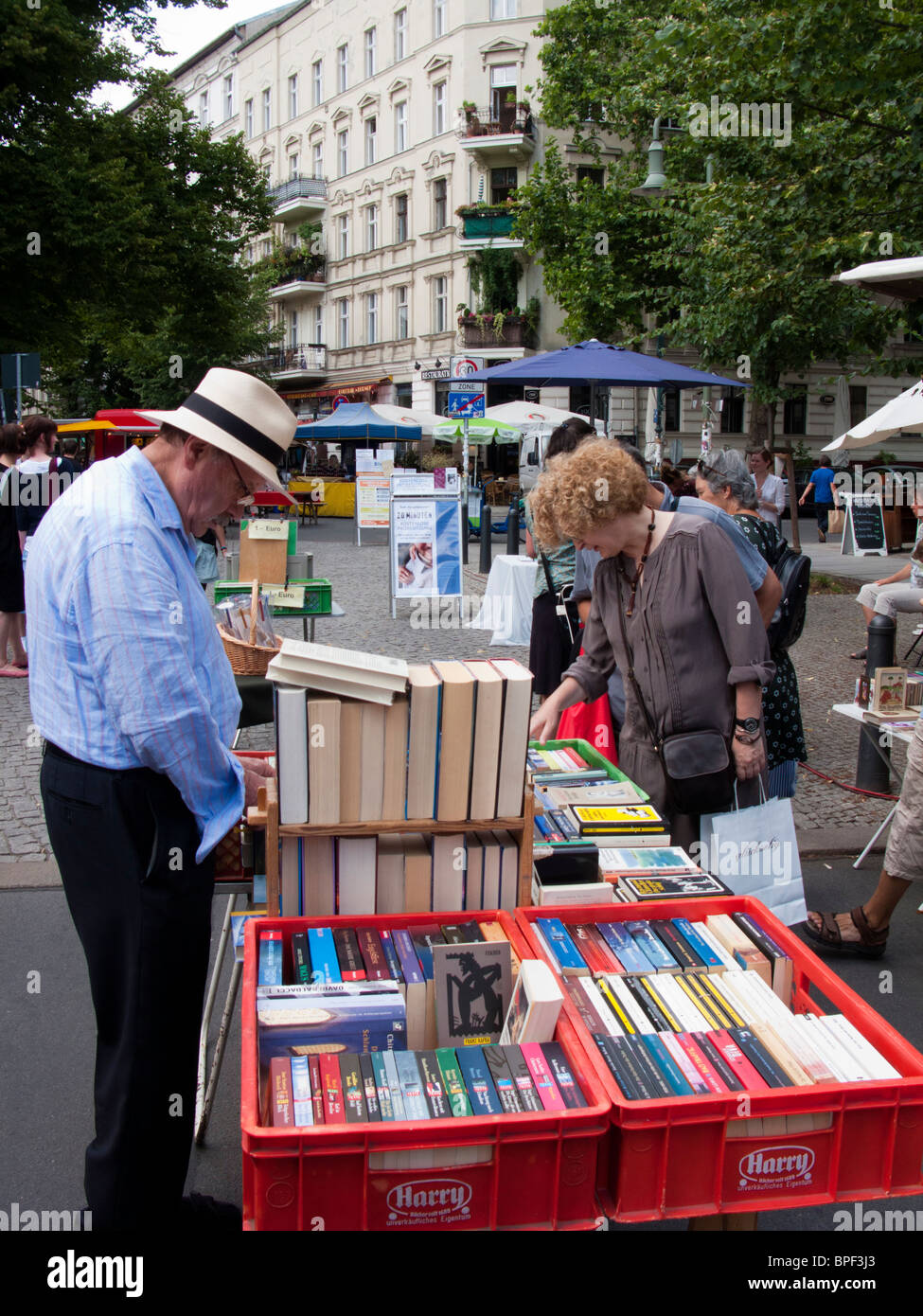 Book stall at outdoor market at Kollwitzplatz in Prenzlauer BErg district of Berlin Germany Stock Photo