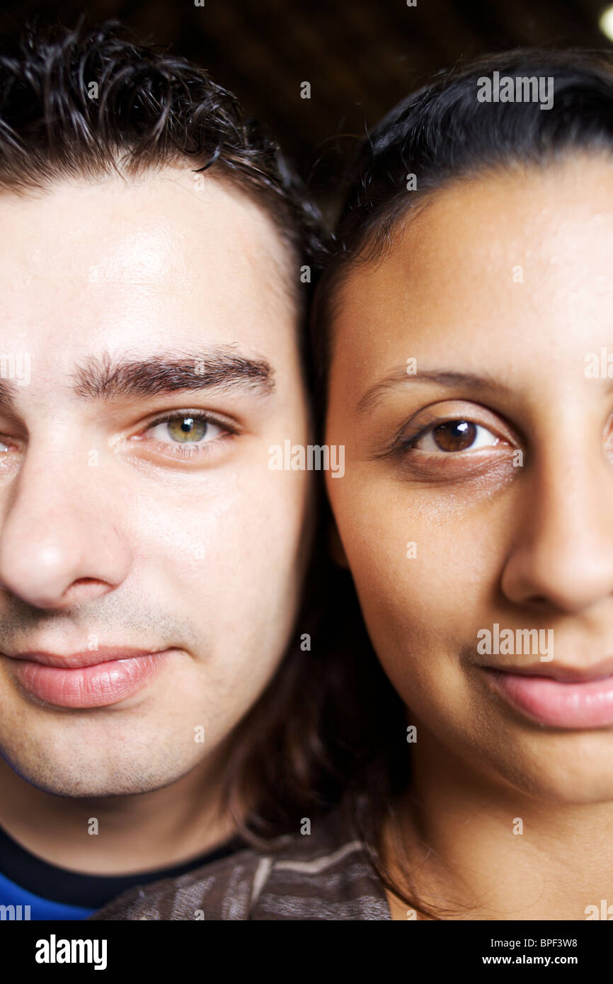 Couple standing cheek to cheek Stock Photo - Alamy