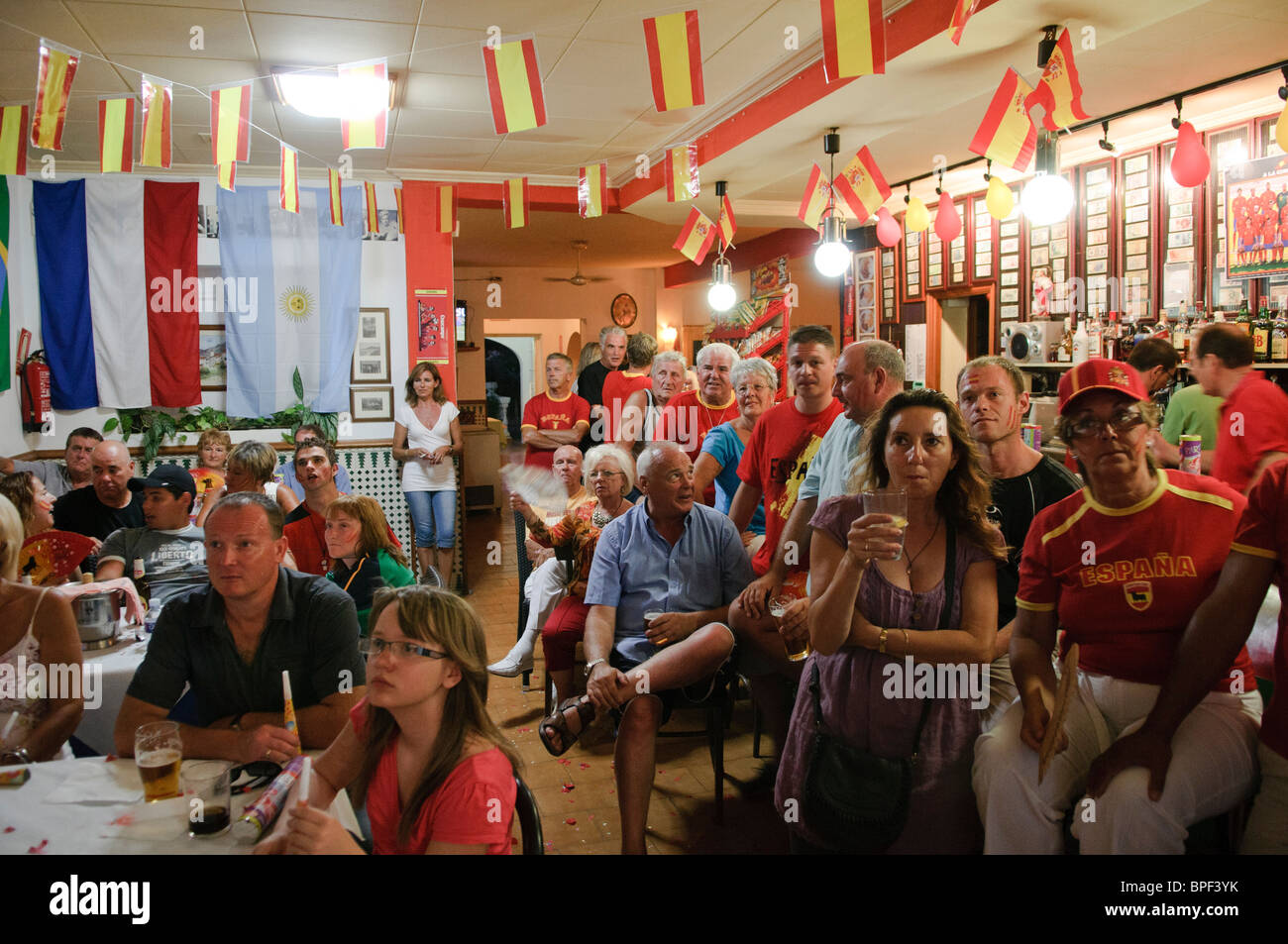 football fans watch the FIFA World Cup 2010 Final on large TV screens inside  bar in Altea La Vella on the Costa Blanca, Spain Stock Photo