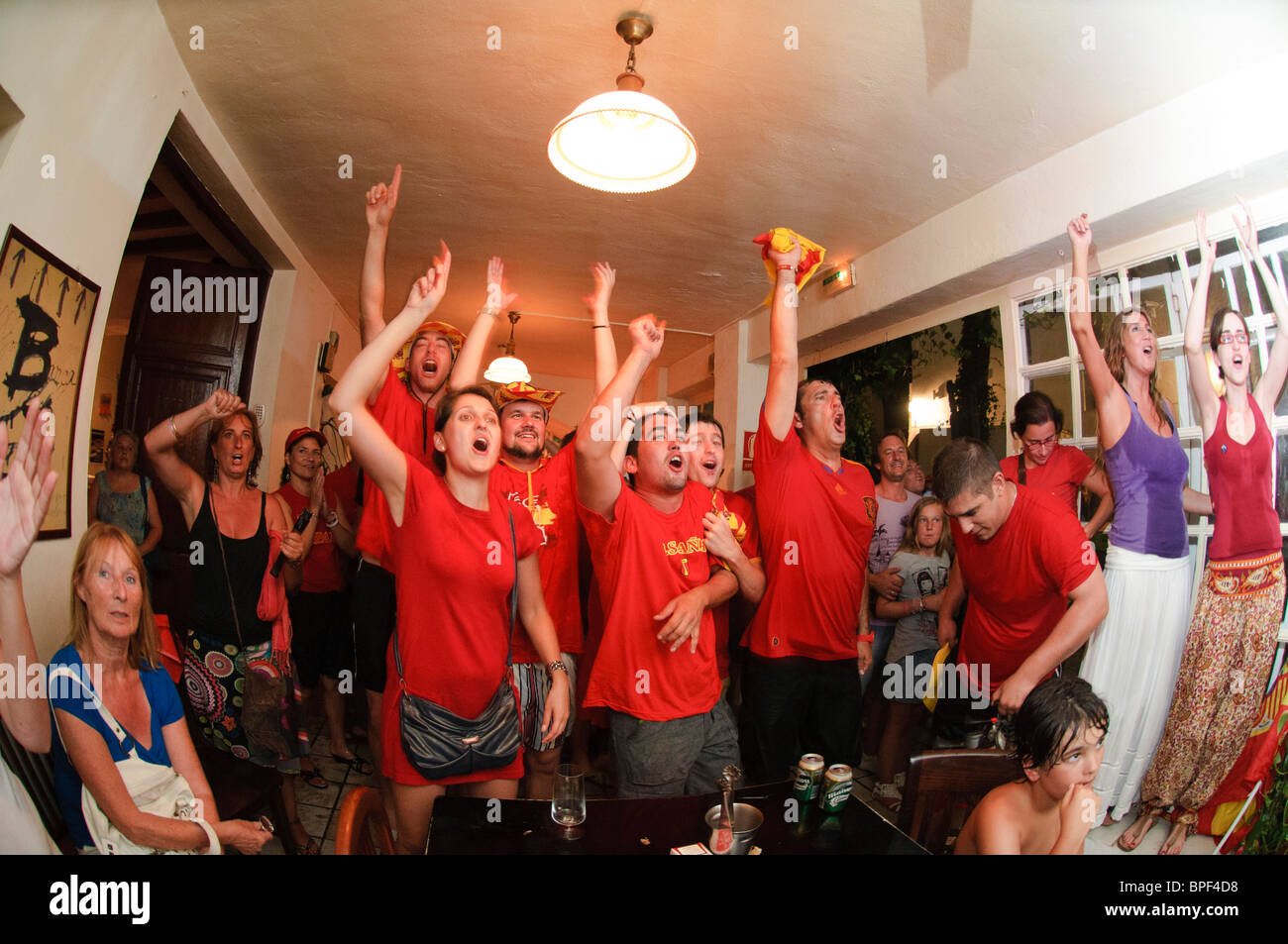 Fans of the spanish national football team celebrate winning the FIFA World Cup 2010 Final in a bar in Altea La Vella, Spain Stock Photo