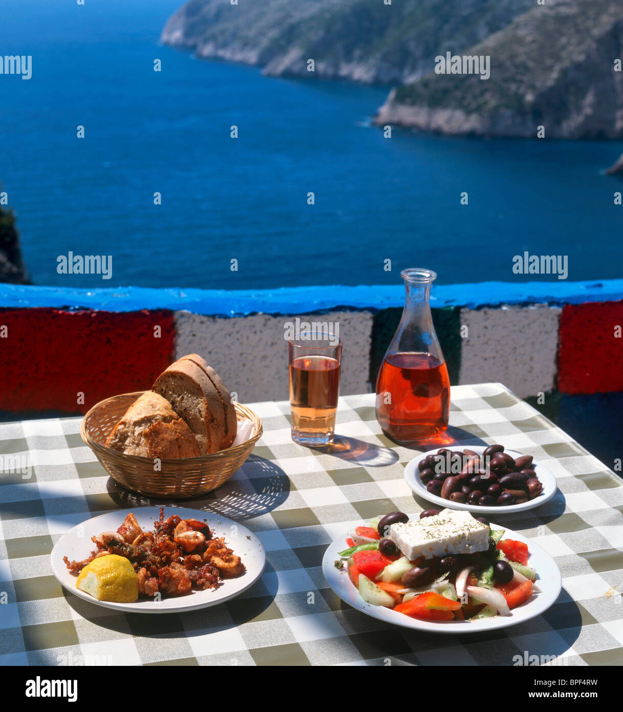 Greek food and wine at a taverna in Kambi, Zakynthos (Zante), Ionian Islands, Greece Stock Photo