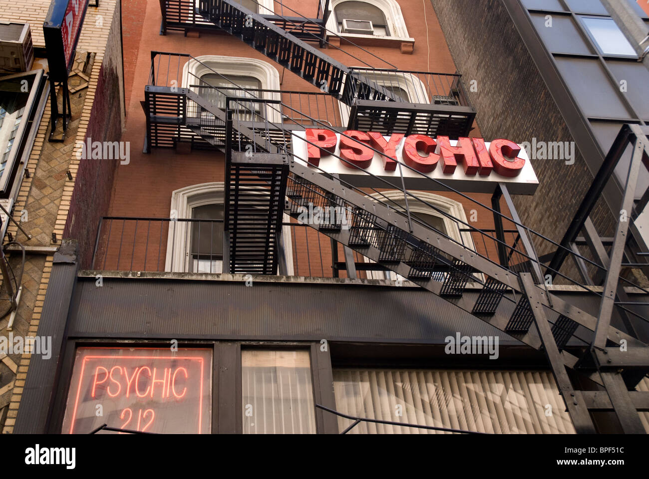 Psychic sign on  building in Harlem New Youk City Stock Photo