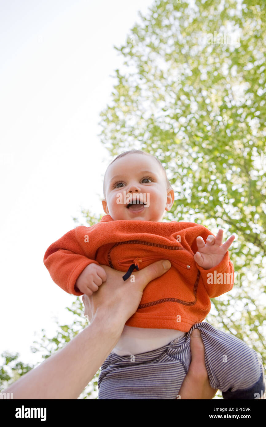 Happy father holding cute hi-res stock photography and images - Alamy