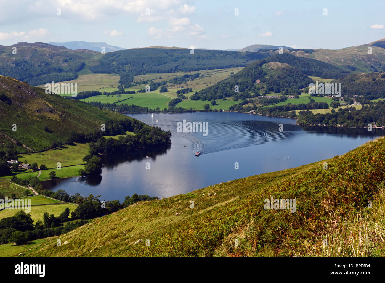 Boat coming into dock on Ullswater in the Lake District National Park, Cumbria. Stock Photo