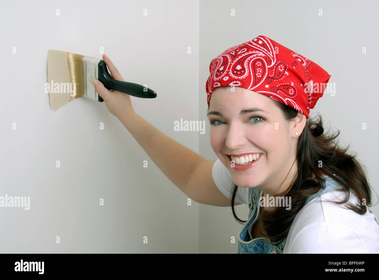 Young Woman Painting The Walls Of Her Home Stock Photo Alamy