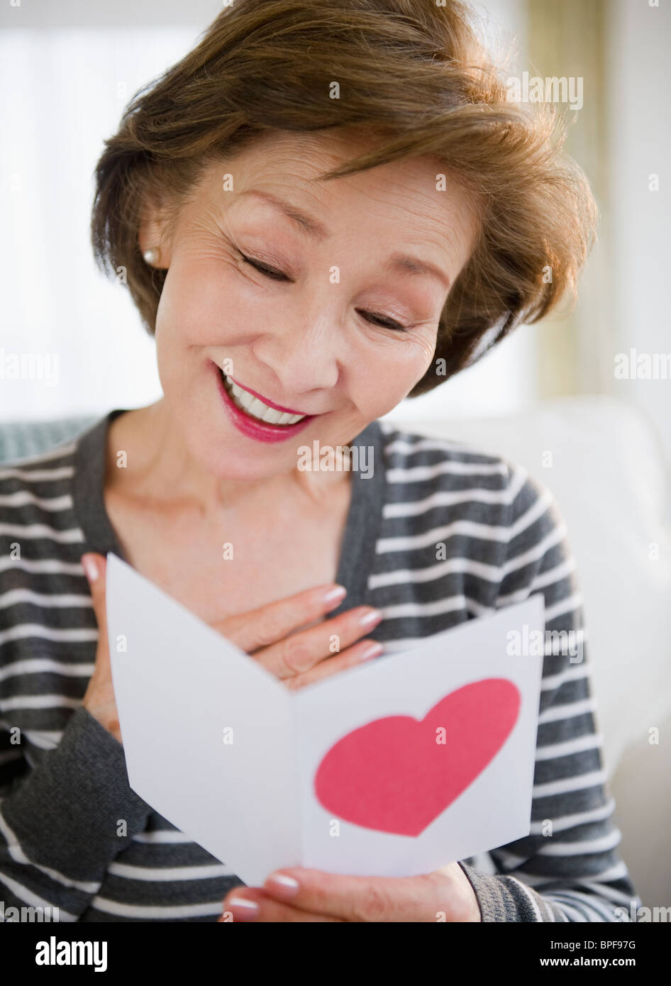 Japanese woman reading valentine card Stock Photo