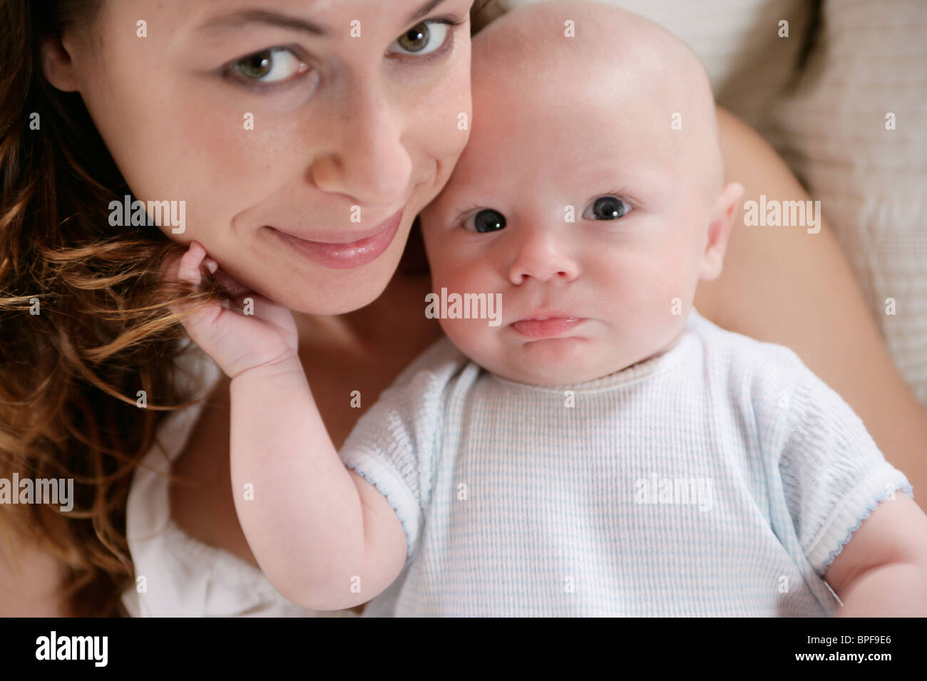 Caucasian mother holding baby Stock Photo Alamy
