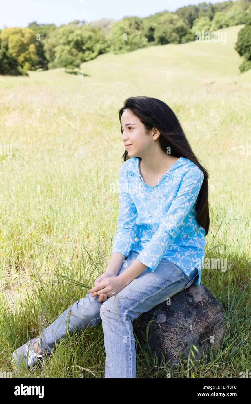 Girl on rock thinking hi-res stock photography and images - Alamy