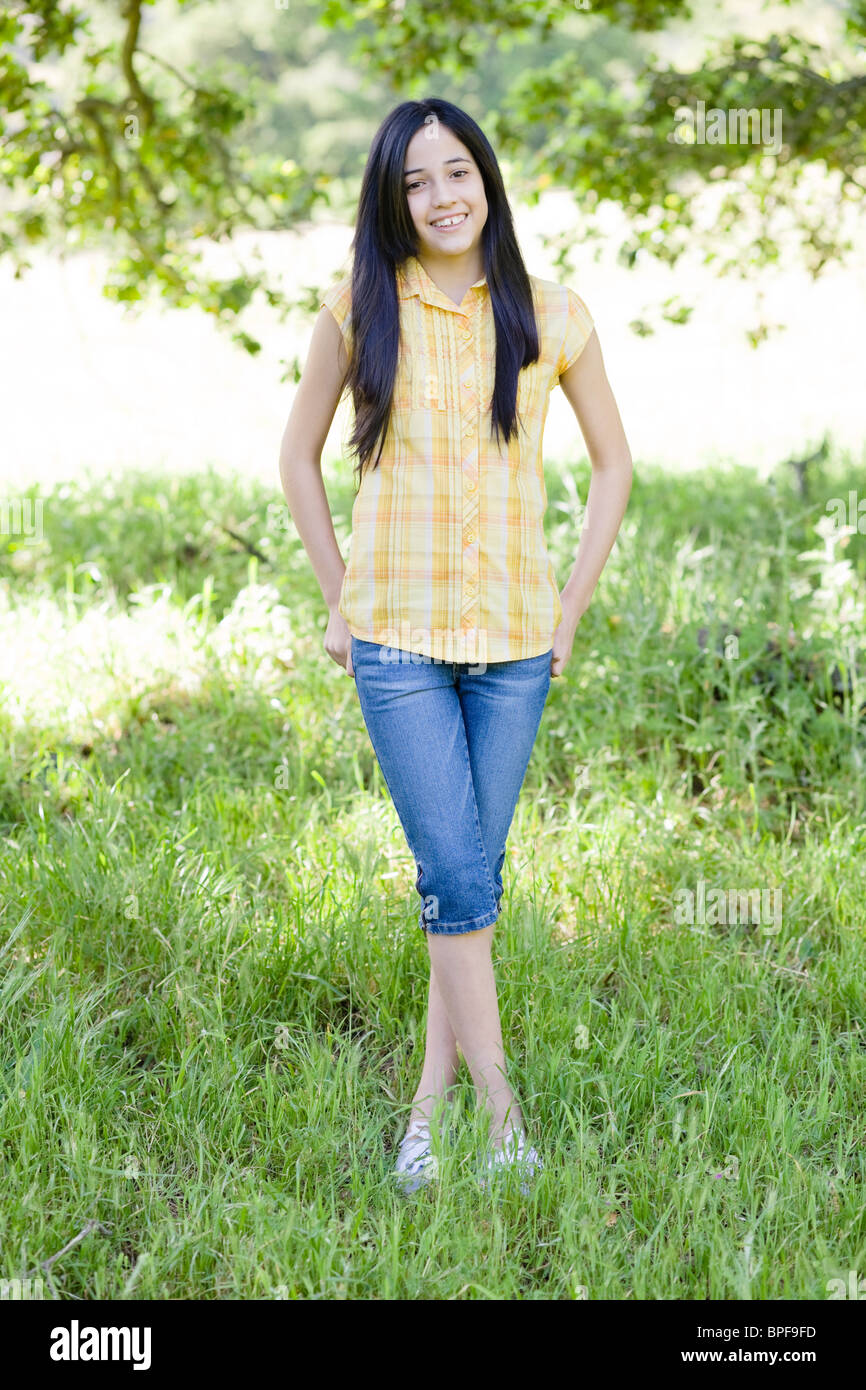 Girl standing legs crossed hi-res stock photography and images - Alamy