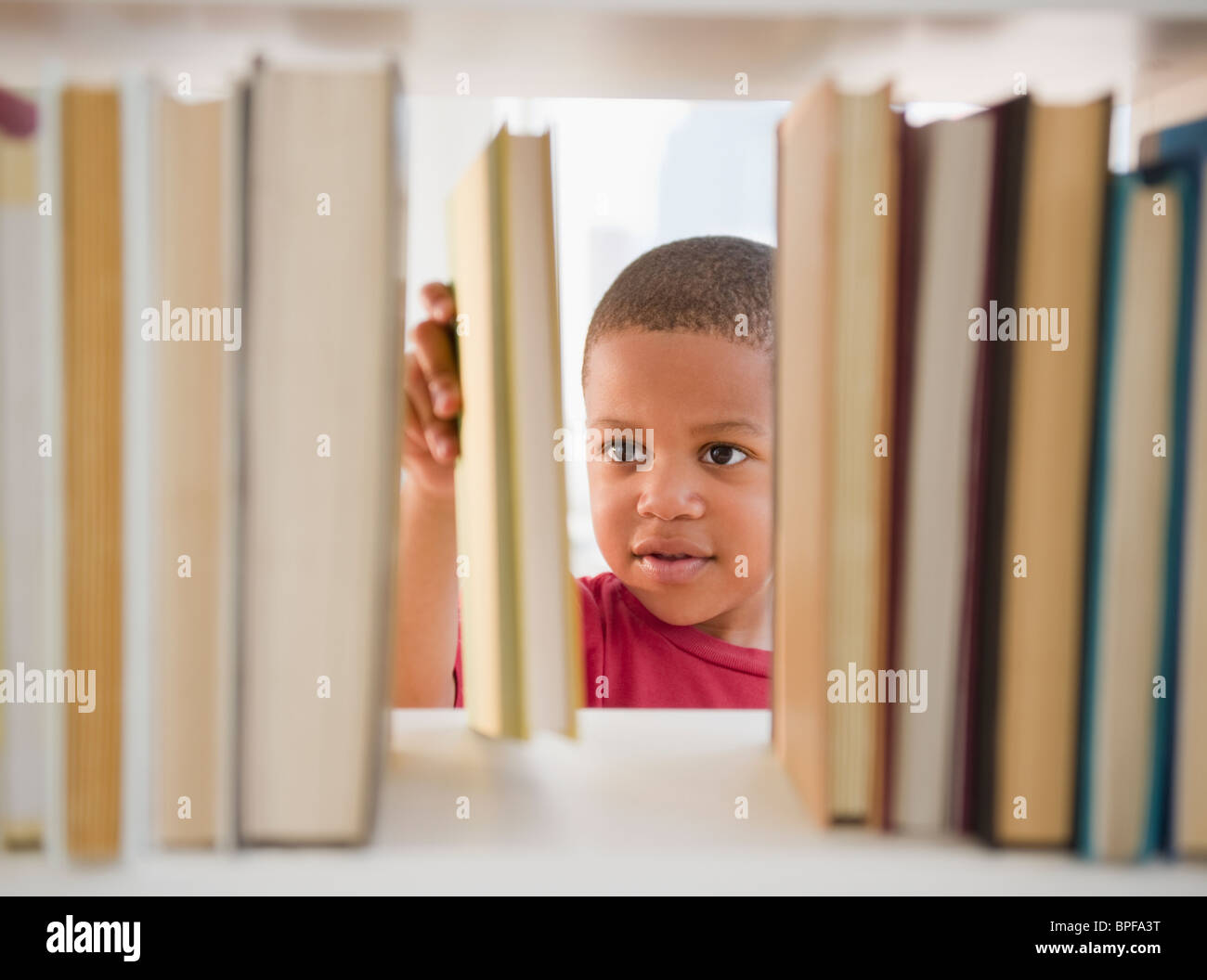 African American boy selecting book Stock Photo