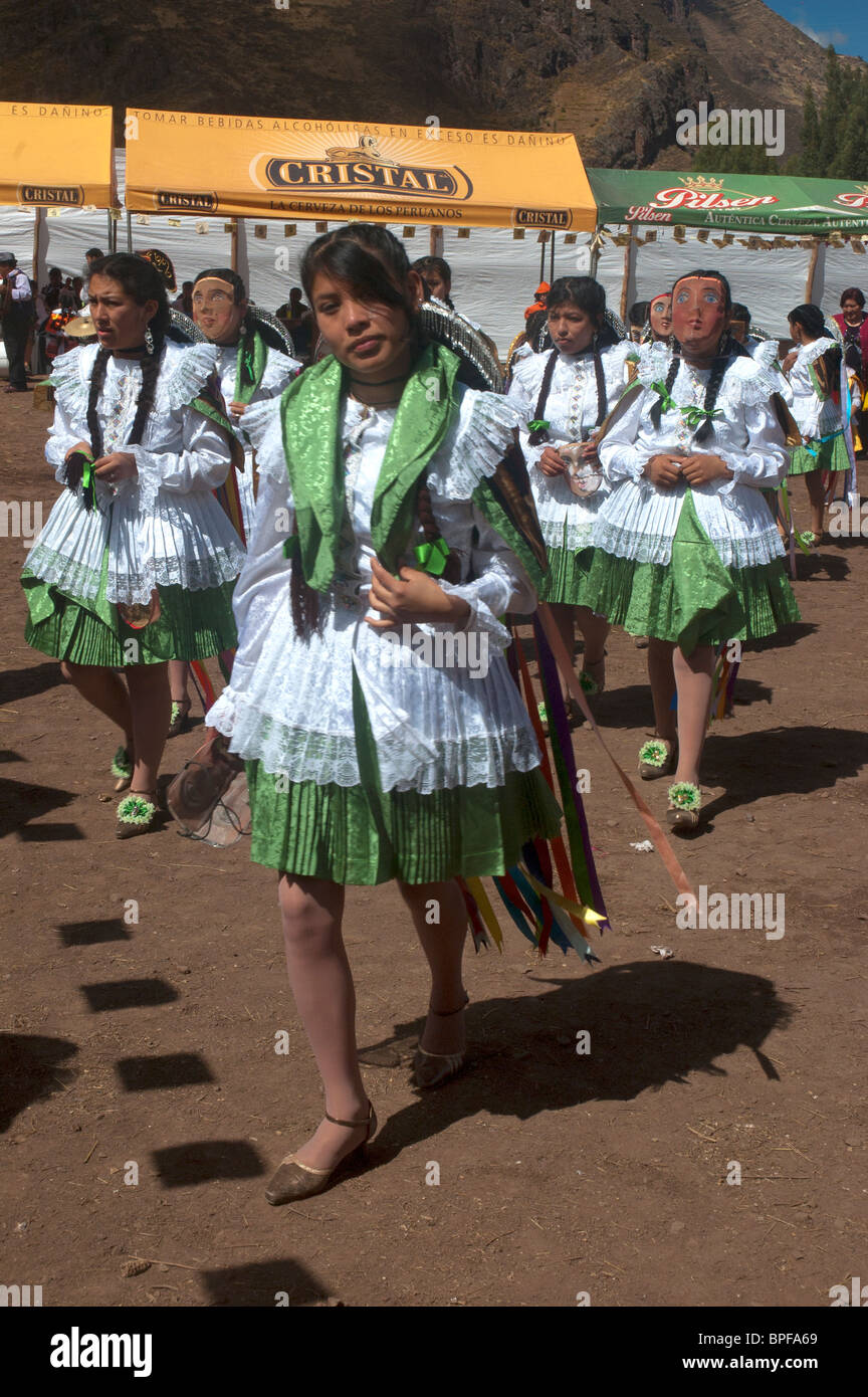 A womens dancing group leaves the arena after competing in the Virgin Carmel Festival, Pisac, Sacred Valley, Peru. Stock Photo
