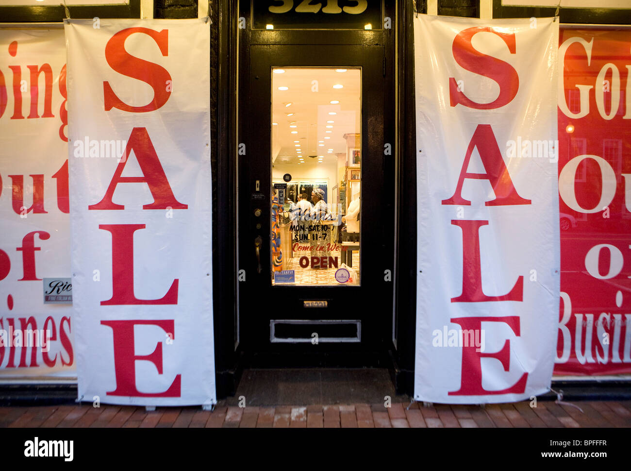 A retail store in Washington, DC with 'Going Out Of Business' signs.  Stock Photo