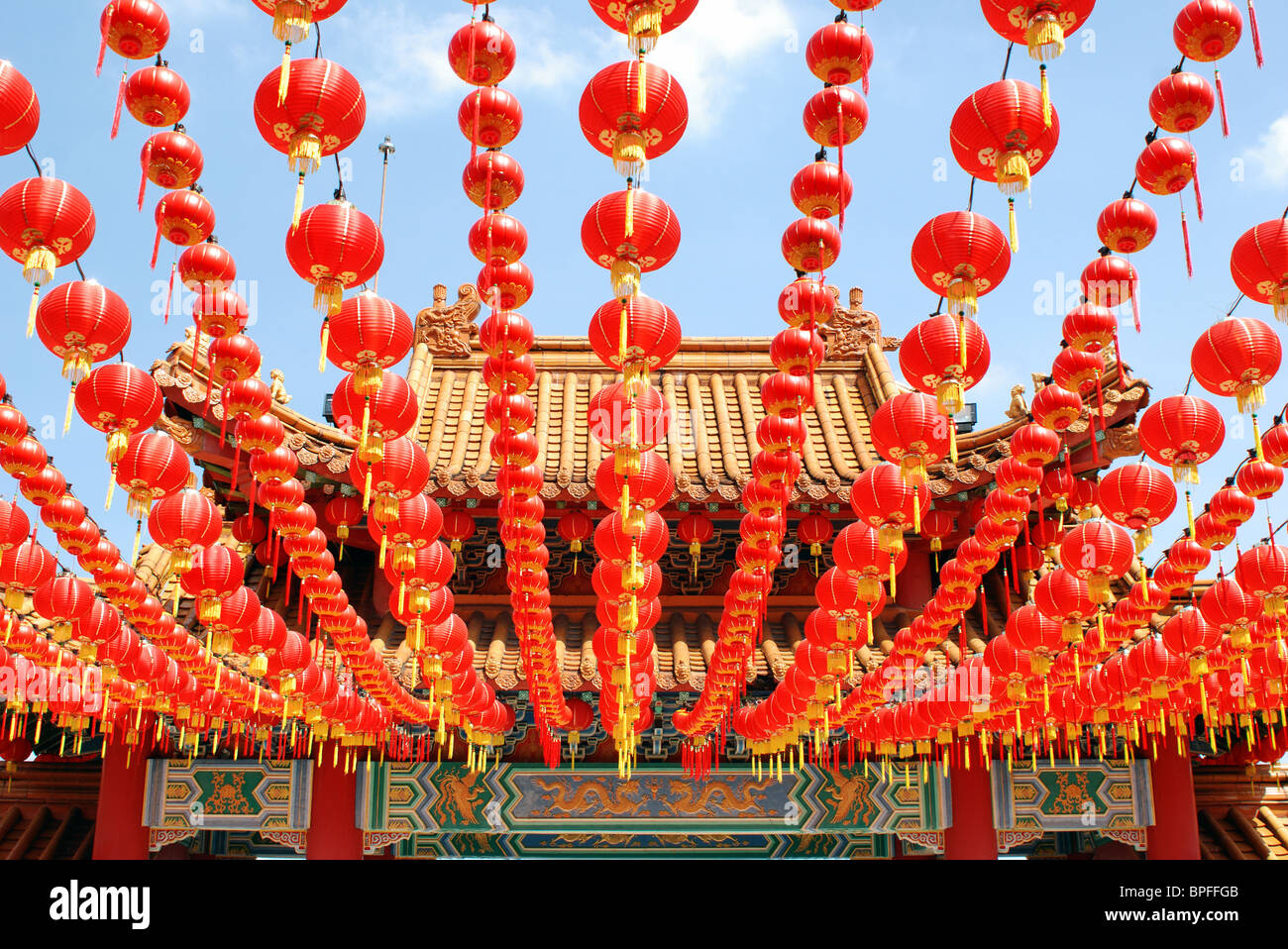 Many red Chinese lanterns hanging in rows above Stock Photo - Alamy