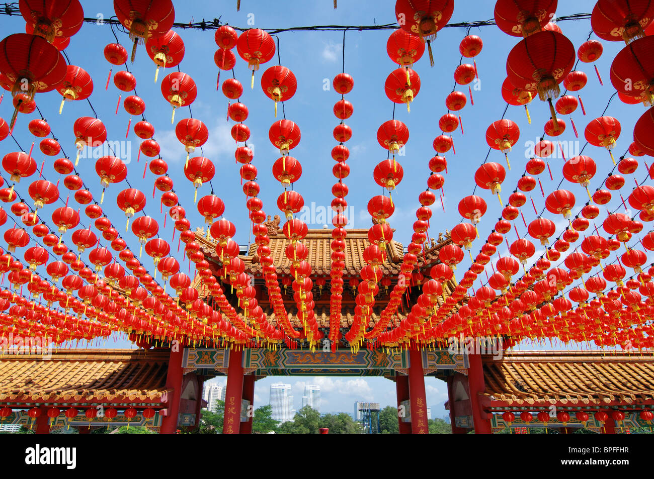Many red Chinese lanterns hanging in rows above Stock Photo - Alamy