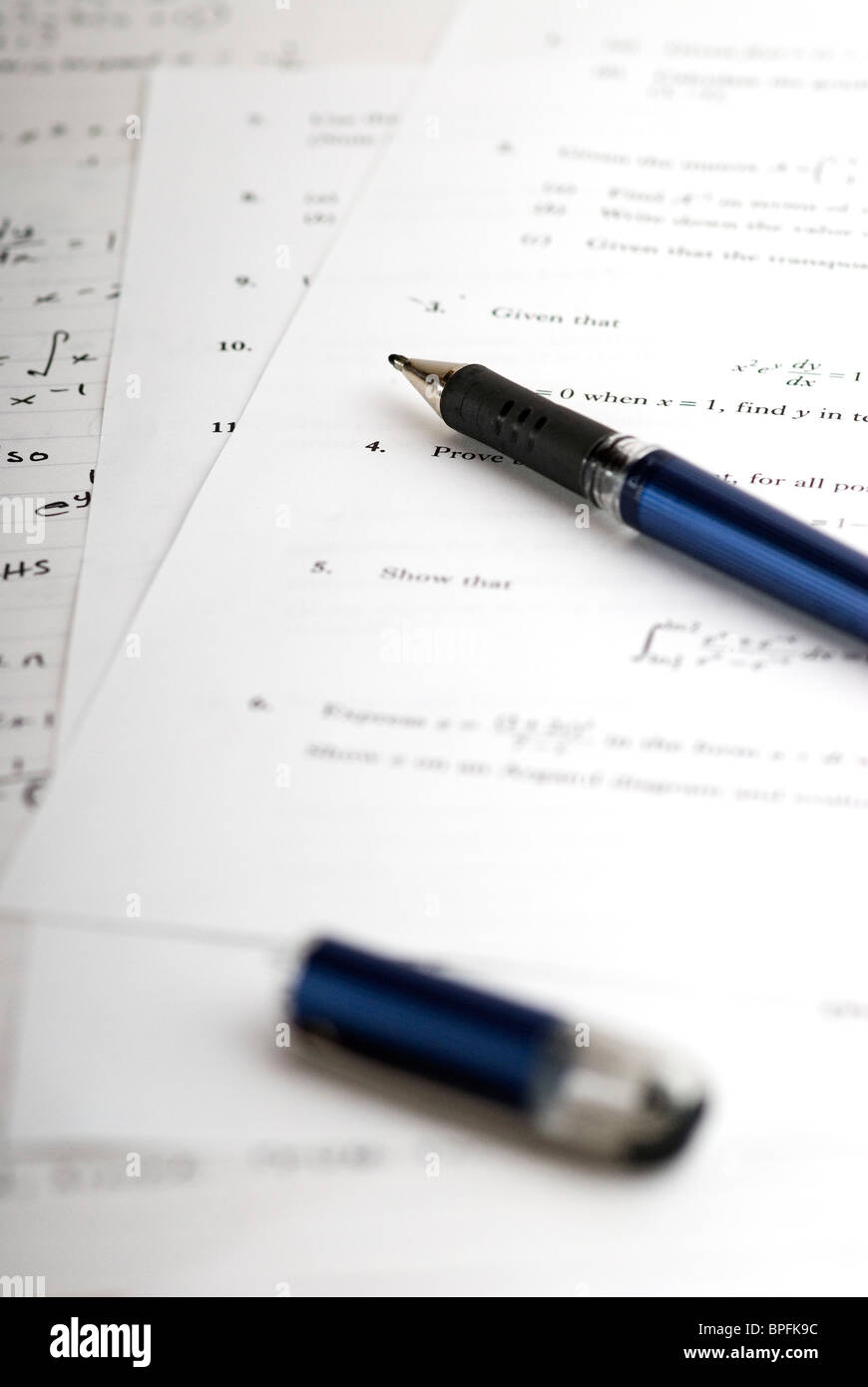 Algebra exam questions with rough written answers. Stock Photo