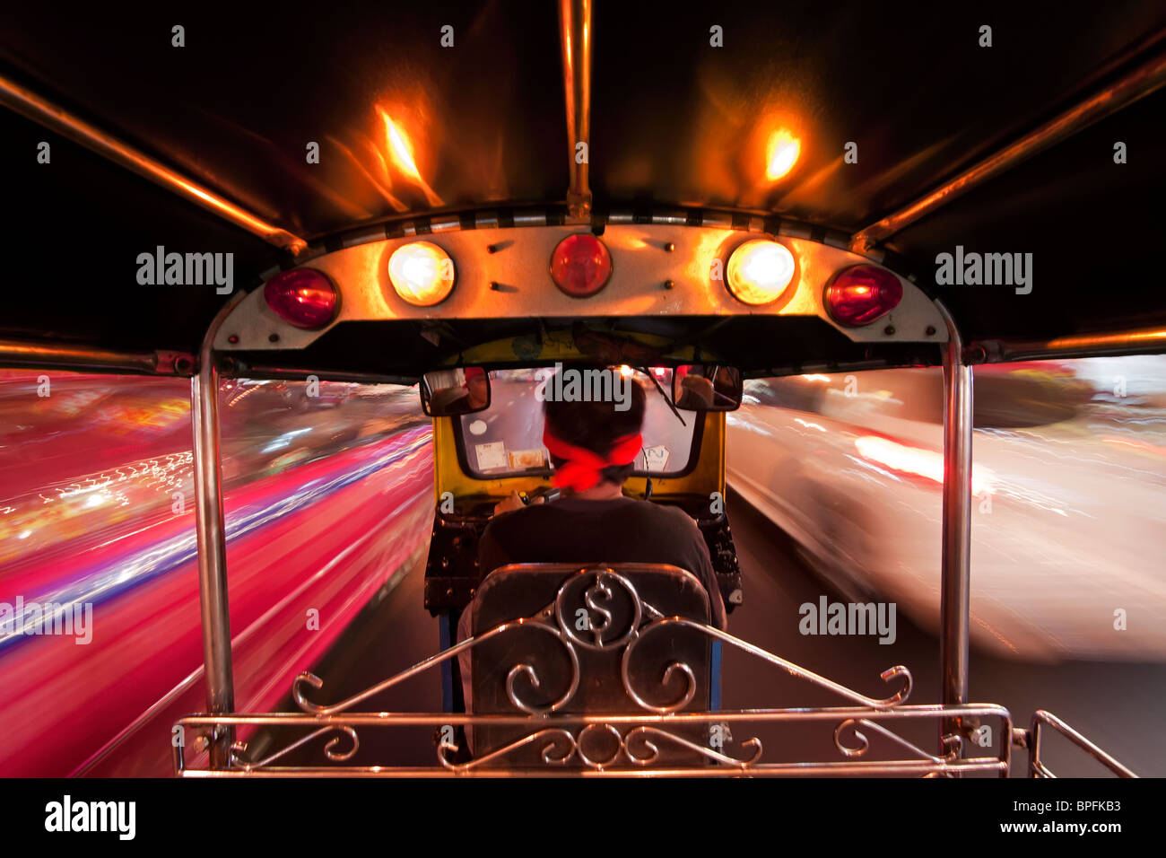 Tuk Tuk or auto rickshaw in motion at night, Bangkok, Thailand, Southeast Asia Stock Photo