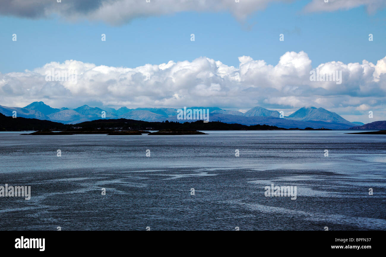 Looking across Loch Carron and Plockton in Wester Ross to the Isle of Skye Cuillin Ridge Stock Photo