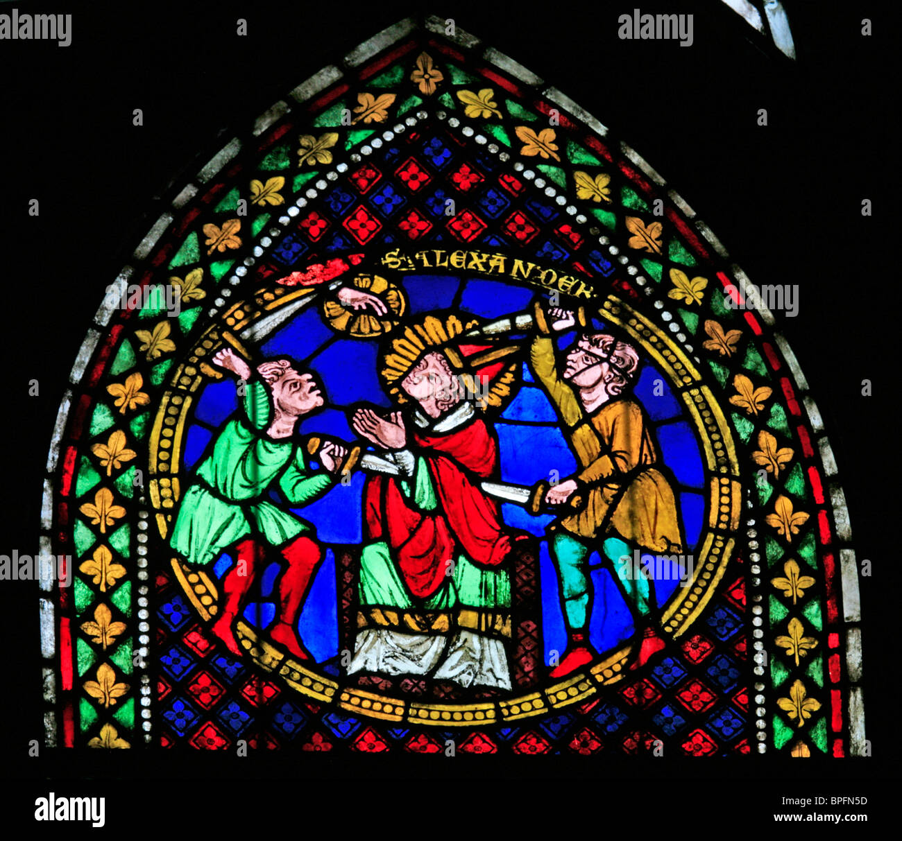 A stained glass window depicting the Martyrdom of Saint Alexander, Freiburg Münster, Baden Wurtemburg, Germany Stock Photo