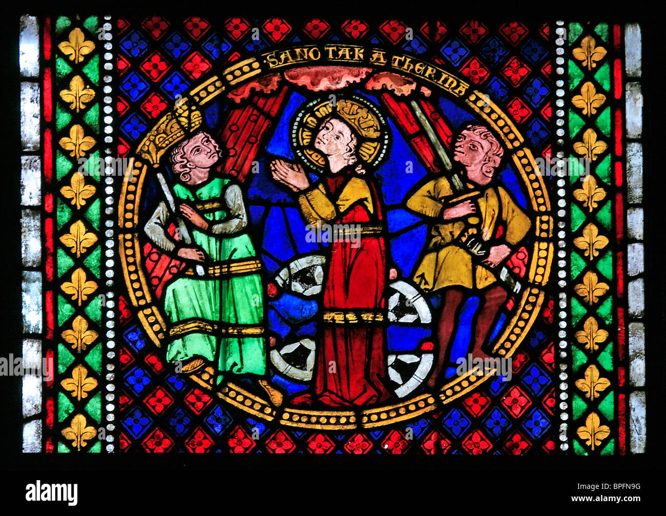 A medieval stained glass window depicting the Martyrdom of Saint Katherine, Freiburg Münster, Baden Wurtemburg, Germany Stock Photo