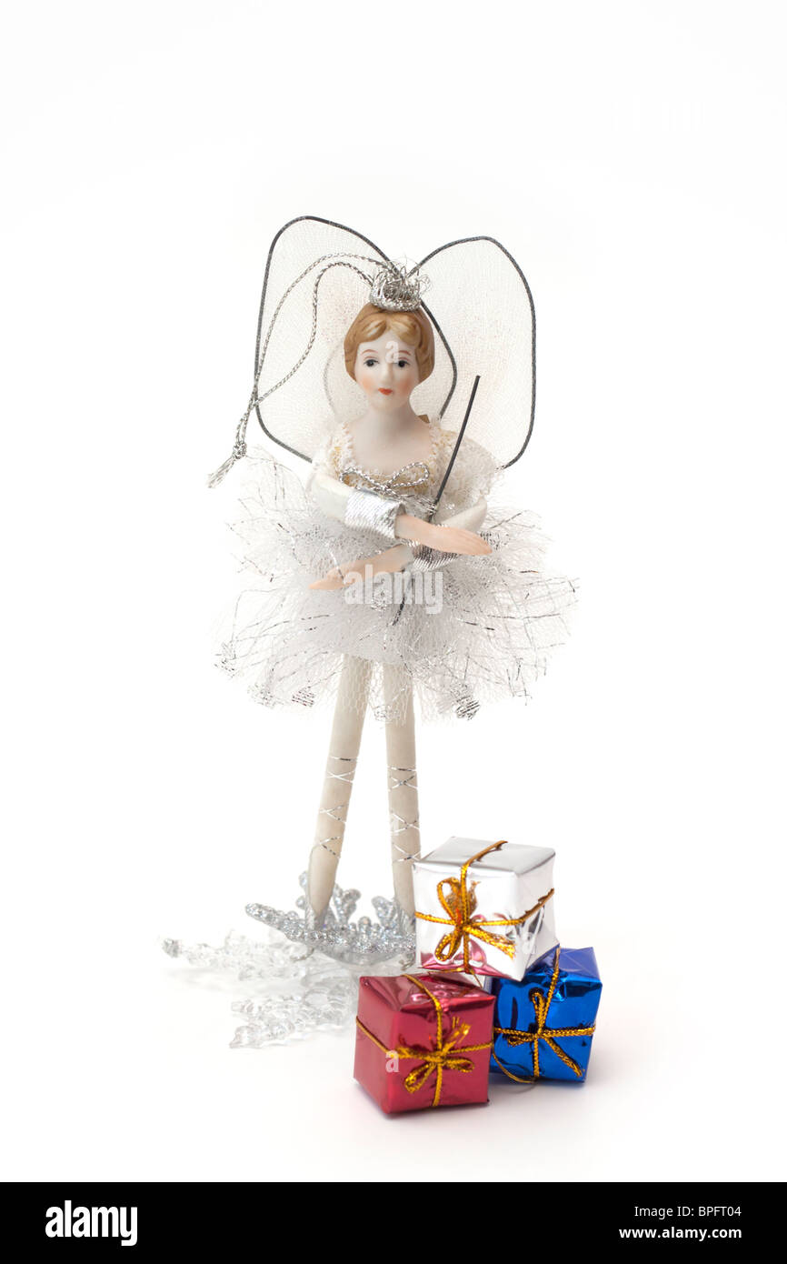 Pretty white and silver treetop fairy Christmas ornament with small foil wrapped boxes on a white background Stock Photo