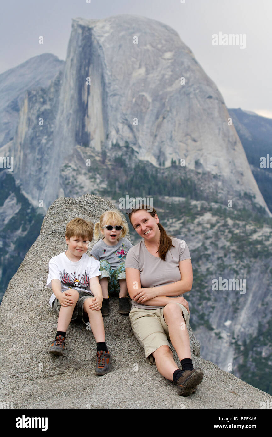Family poses in Yosemite with the Half Dome in the background Stock Photo