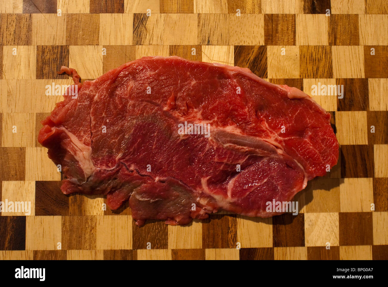 Meat on a chopping board Stock Photo Alamy