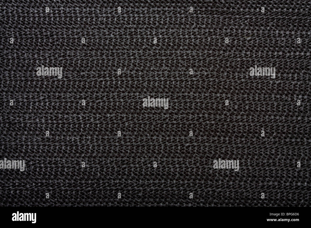 Black non slip Silicon or rubber mat background or texture. Stock Photo