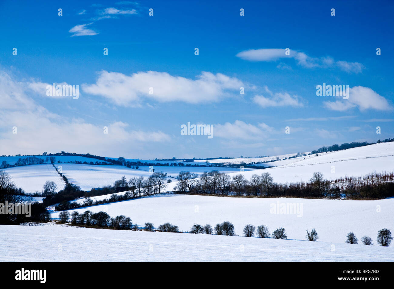 A sunny,snowy,winter landscape view or scene on the Downs in Wiltshire, England, UK Stock Photo