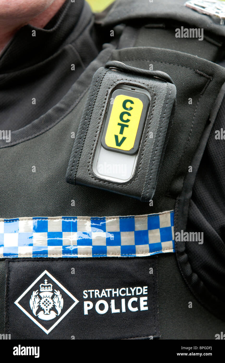 A Strathclyde Police officer using a personal CCTV. The digital cameras are worn on the shoulder and record sound and images. Stock Photo