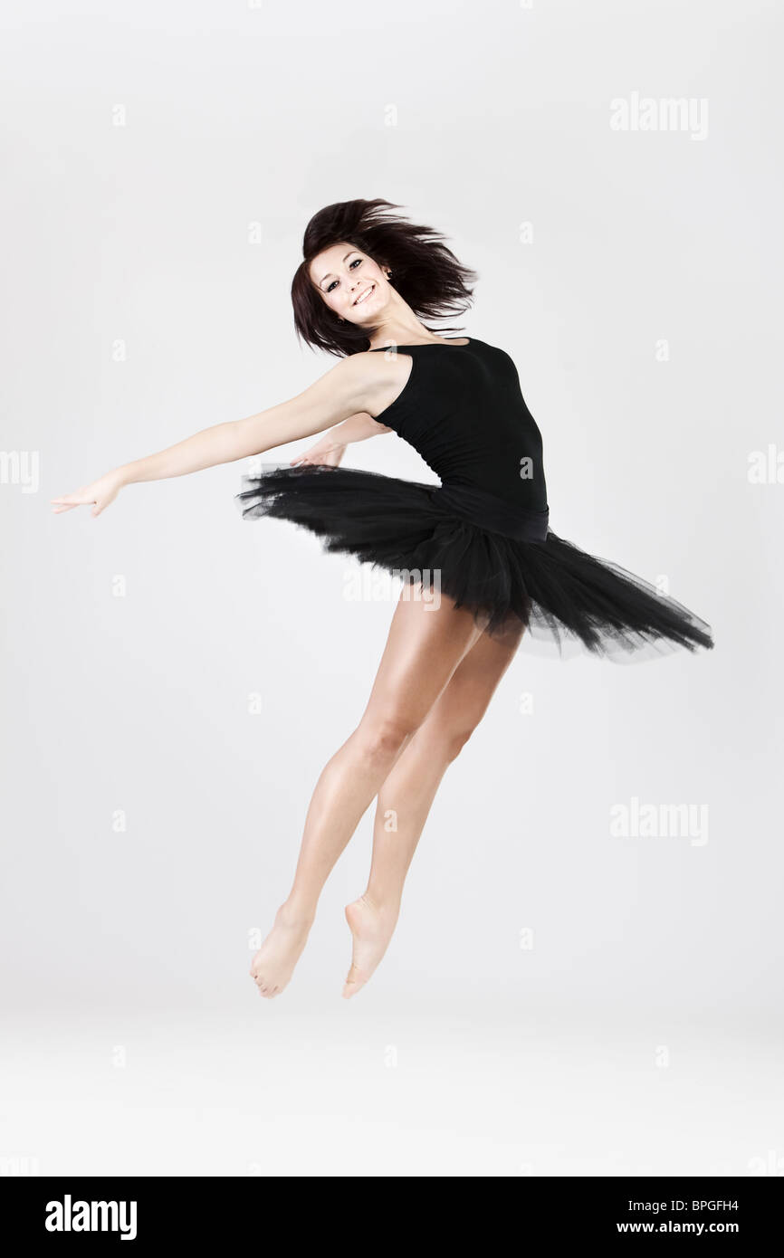 Stylish and young ballet style dancer is jumping arched  Stock Photo