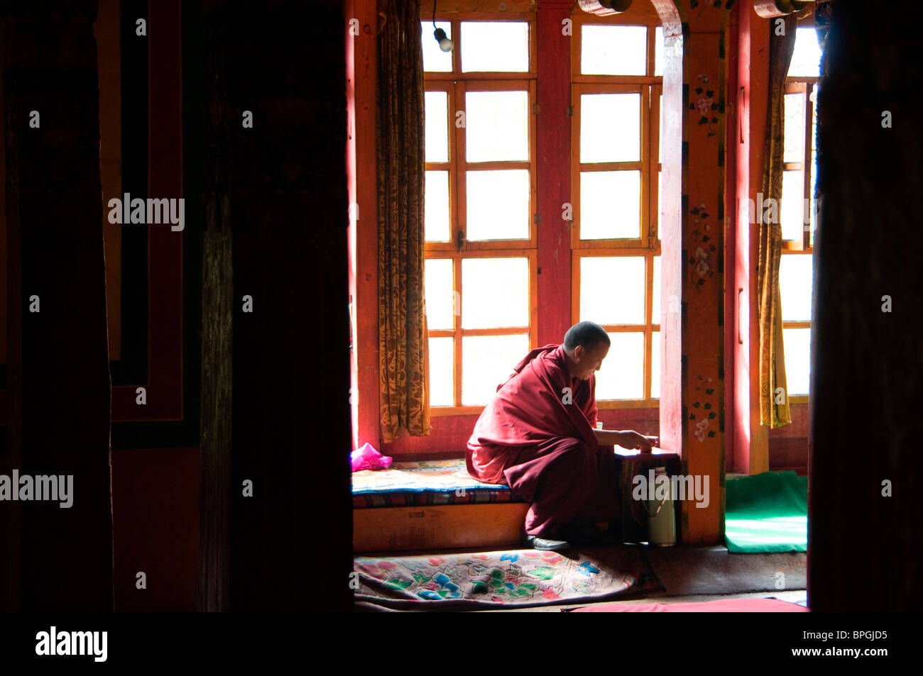 Tibetan monk prepares tea hires stock photography and images Alamy