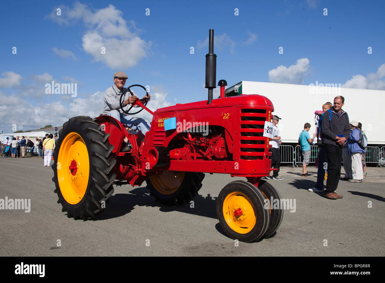 Vintage red tractor machinery parade at agricultural pembrokeshire