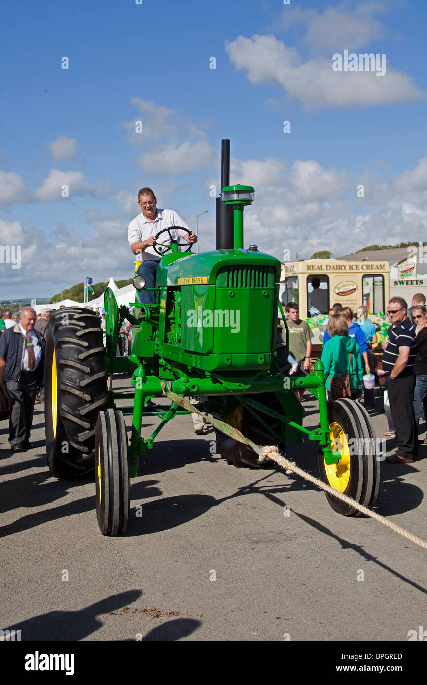 Vintage John Deere tractor machinery parade at agricultural