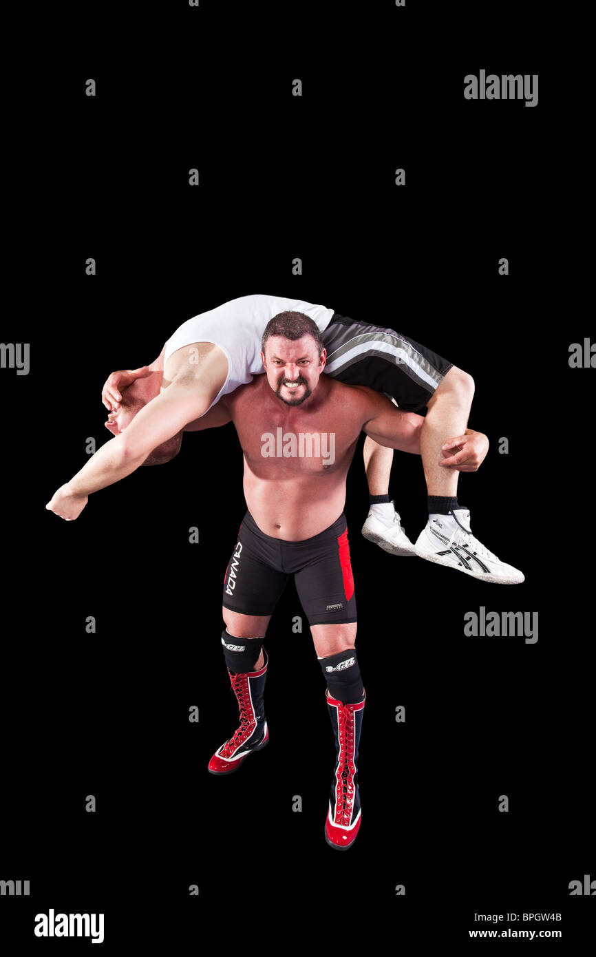 wrestler with man on shoulders Stock Photo