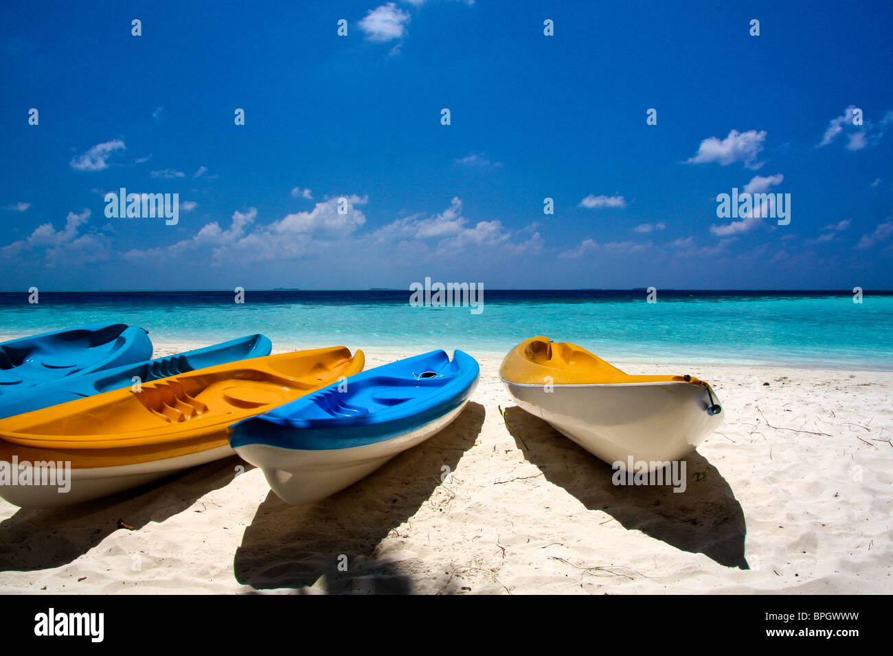 Canoes lying on the bach of Vilamendhoo, Maldives Stock Photo