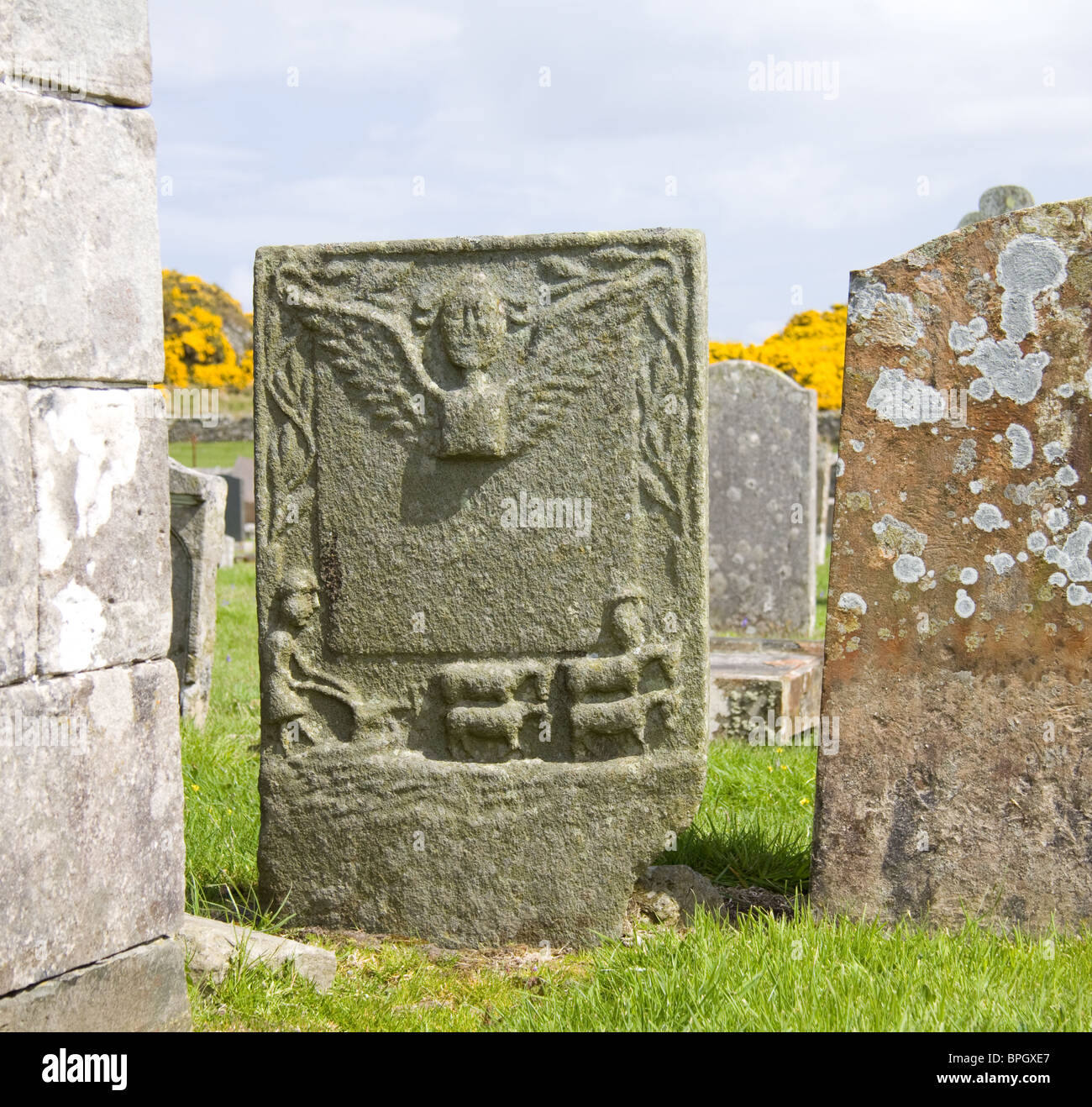 An winged spirit (ascending to Heaven) and ploughman design on an 18th century gravestone, Skipness, Scotland Stock Photo