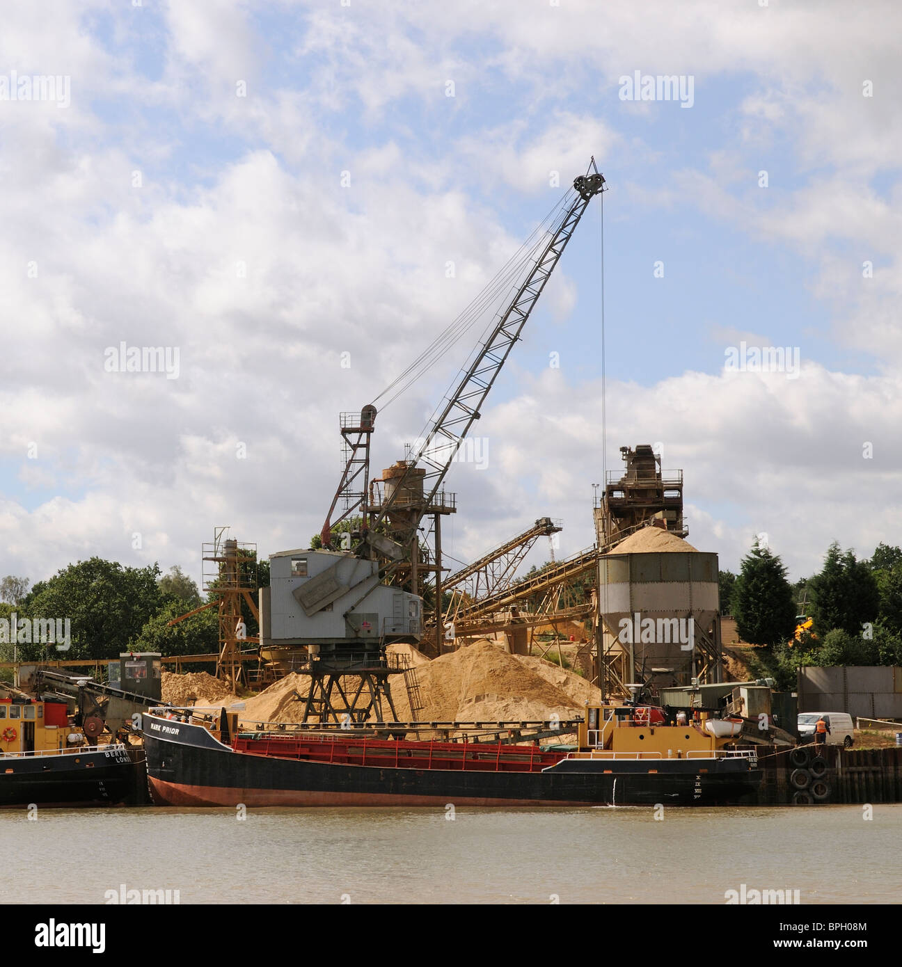 The Mark Prior sandbarge taking on a cargo of sand at J J Prior on the